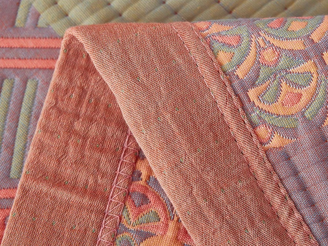 Close-up edge stitching and woven texture of Colorful Harmony Cotton Woven Quilt Pastel Pink
