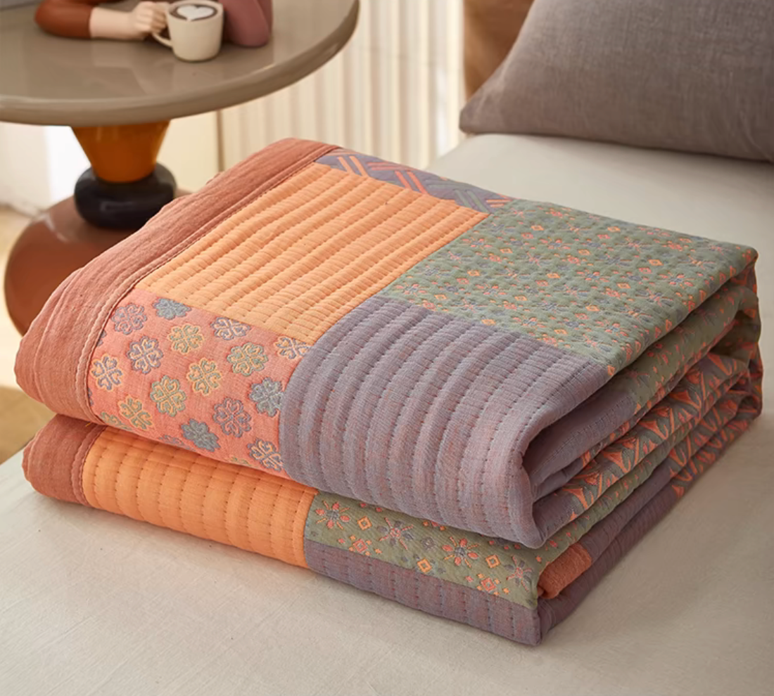 Colorful Harmony Cotton Woven Quilt Pastel Pink folded lightweight cotton quilt with patchwork woven design