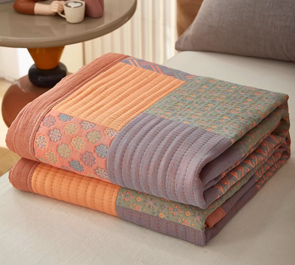Colorful Harmony Cotton Woven Quilt Pastel Pink folded lightweight cotton quilt with patchwork woven design