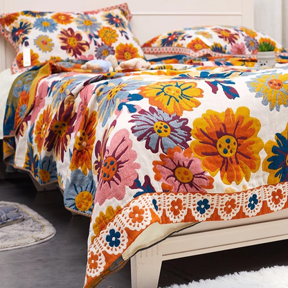 Colorful Super Soft Long-staple Cotton Blanket Blooming displayed across a cozy bedroom bed with colorful floral design