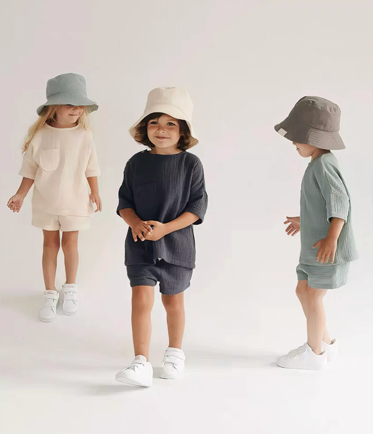 Kids wearing crinkle gauze cotton two piece set in multiple colors soft breathable baby outfit lifestyle view
