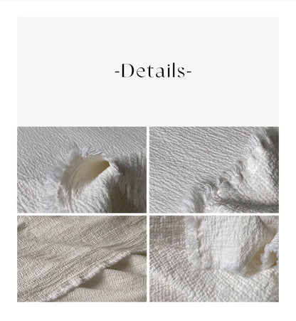 Modern bedroom scene with ivory white French flax linen duvet thin quilt showing soft natural linen bedding draped across bed