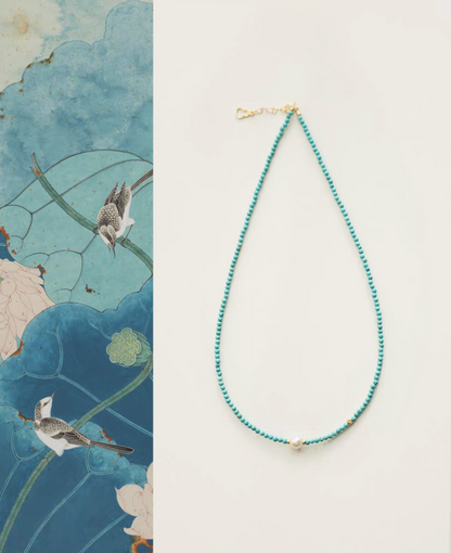 Micro turquoise bead choker with single freshwater pearl and gold clasp full product view on clean background