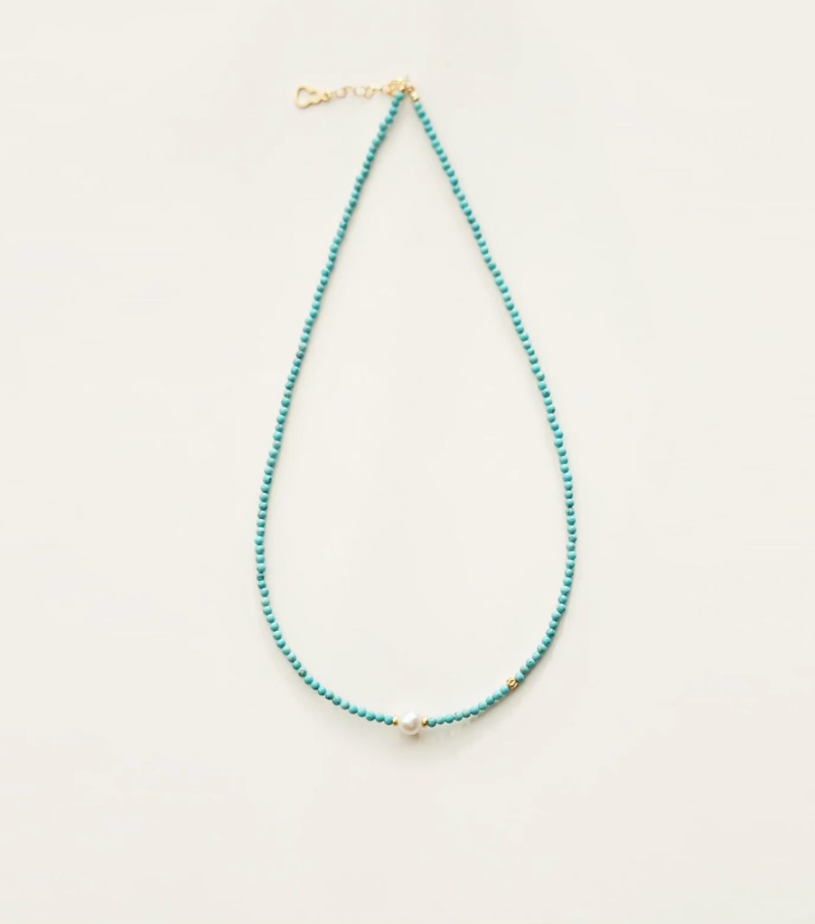 Micro turquoise bead choker featuring a centered freshwater pearl with gold spacer bead detail close-up