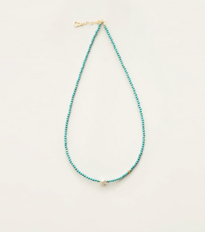 Micro turquoise bead choker featuring a centered freshwater pearl with gold spacer bead detail close-up