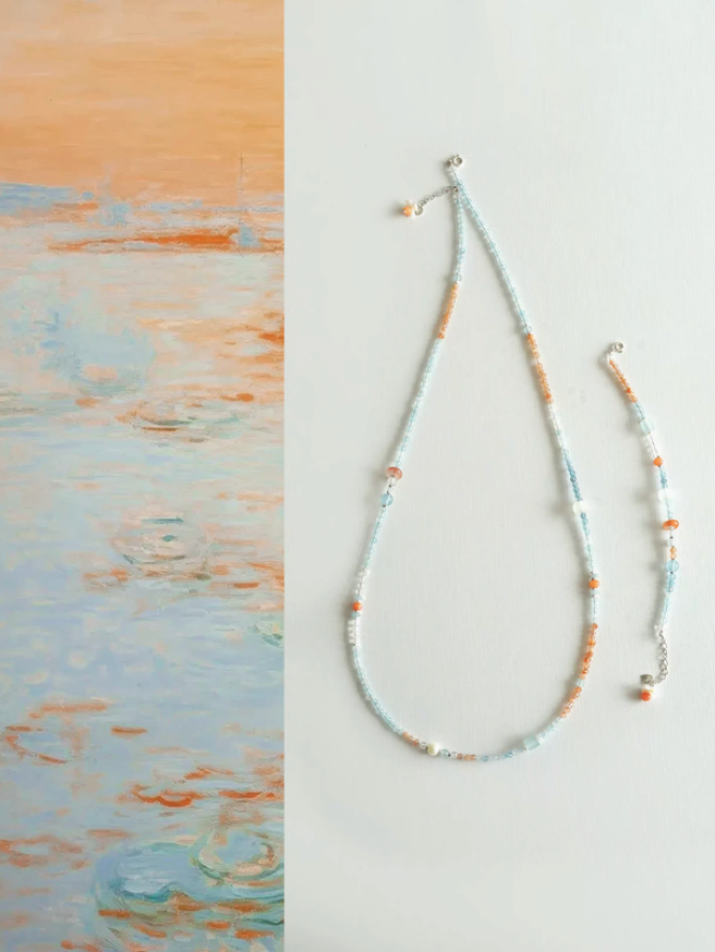 Vintage aquamarine crystal choker with mixed natural stones including sunstone, pearl, and white jade full product view on clean background