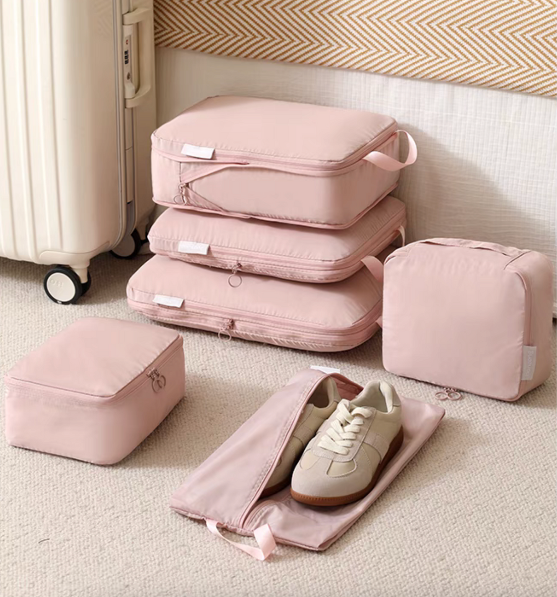 Bean Pink Compression Travel Packing Cubes with Shoe and Clothing Organizer Set displayed on floor with multiple cubes and open shoe bag beside suitcase