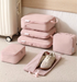 Bean Pink Compression Travel Packing Cubes with Shoe and Clothing Organizer Set displayed on floor with multiple cubes and open shoe bag beside suitcase