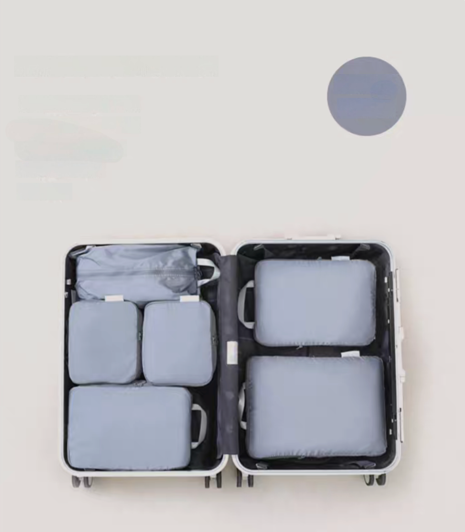 Misty Blue Compression Travel Packing Cubes with Shoe and Clothing Organizer Set showing the 7pcs suitcase layout