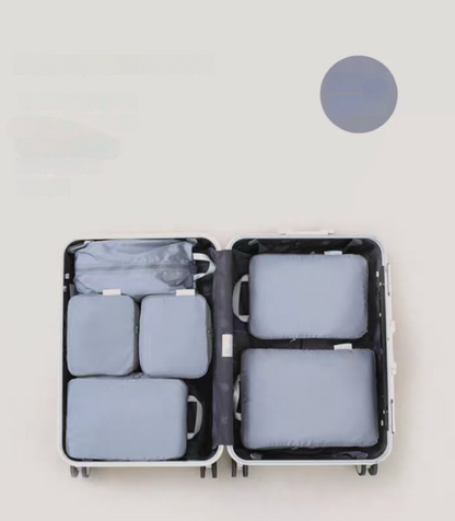 Misty Blue Compression Travel Packing Cubes with Shoe and Clothing Organizer Set showing the 7pcs suitcase layout
