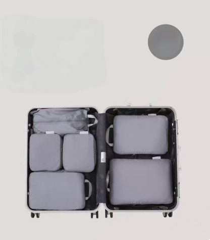 Ultimate Gray Compression Travel Packing Cubes with Shoe and Clothing Organizer Set showing the 7pcs suitcase layout
