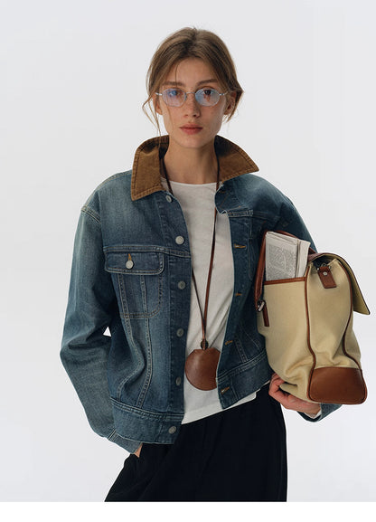 Denim jacket with brown corduroy collar styled with cream canvas leather-trim tote bag