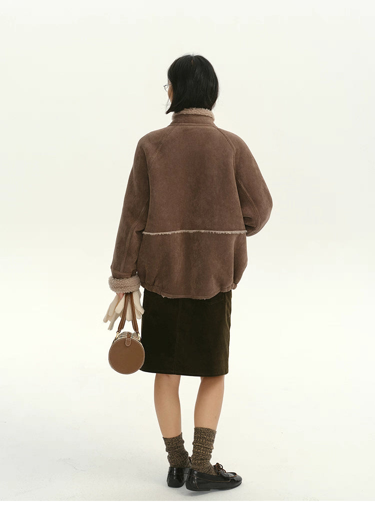 Back view of cocoa brown shearling-trim suede jacket with contrast seam detail