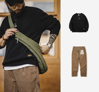 Man wearing olive quilted vest bag as crossbody over black knit outfit urban look.