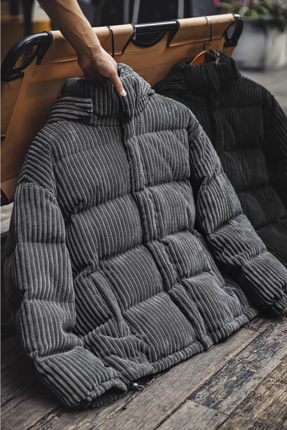 Dark Gray corduroy down jacket hanging on rack highlighting thick quilted texture and structured collar design