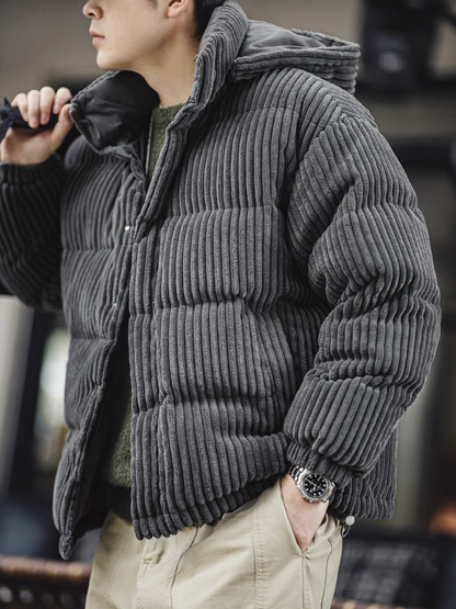 Man wearing Dark Gray corduroy down jacket side angle showcasing ribbed fabric texture and relaxed fit styling