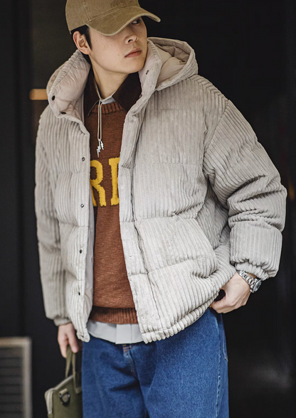 Man wearing Misty Gray corduroy down jacket front view styled with sweater for warm casual outfit