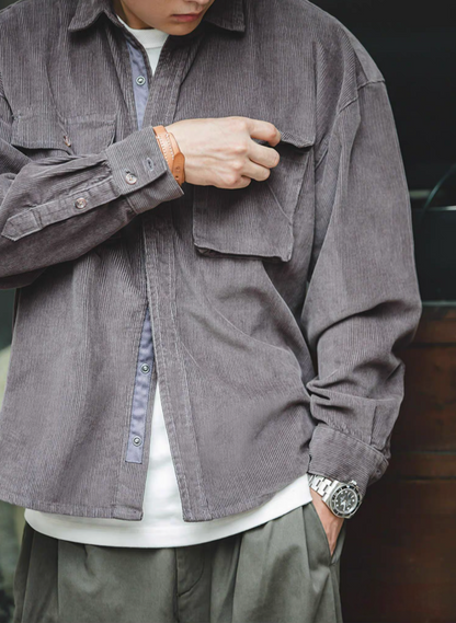 Close-up of Smoke Gray Corduroy Field Shirt worn by model highlighting chest pocket and textured fabric