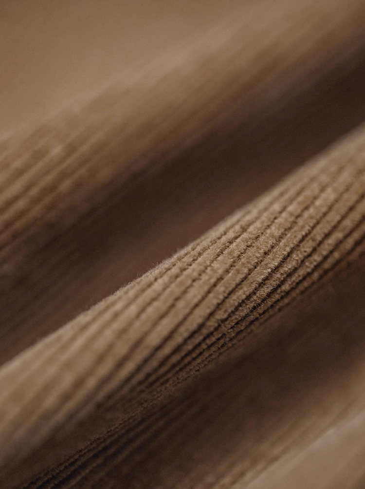 Close-up of desert brown corduroy fabric texture