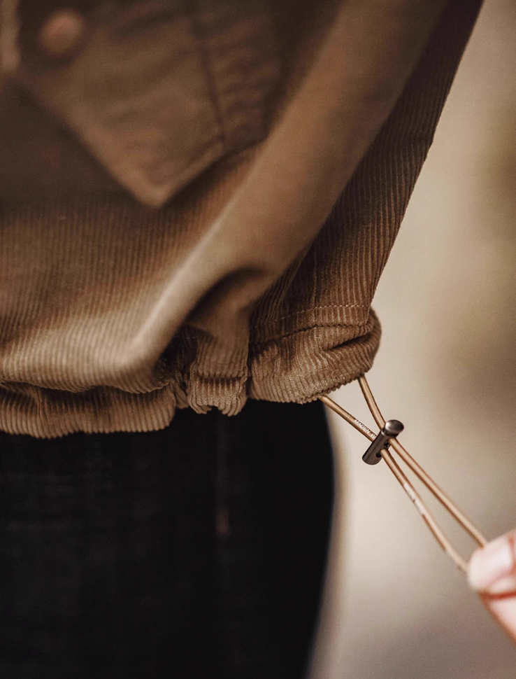 Adjustable drawcord hem detail on corduroy Harrington jacket