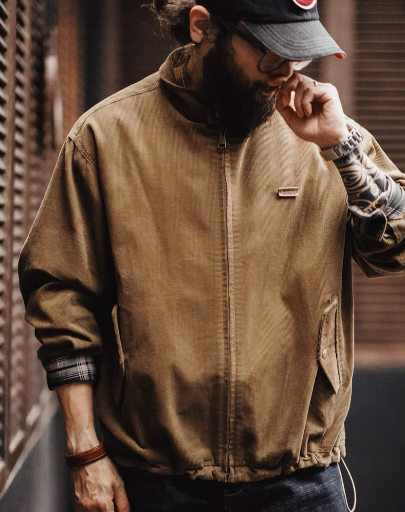 Model wearing corduroy Harrington jacket styled with casual jeans