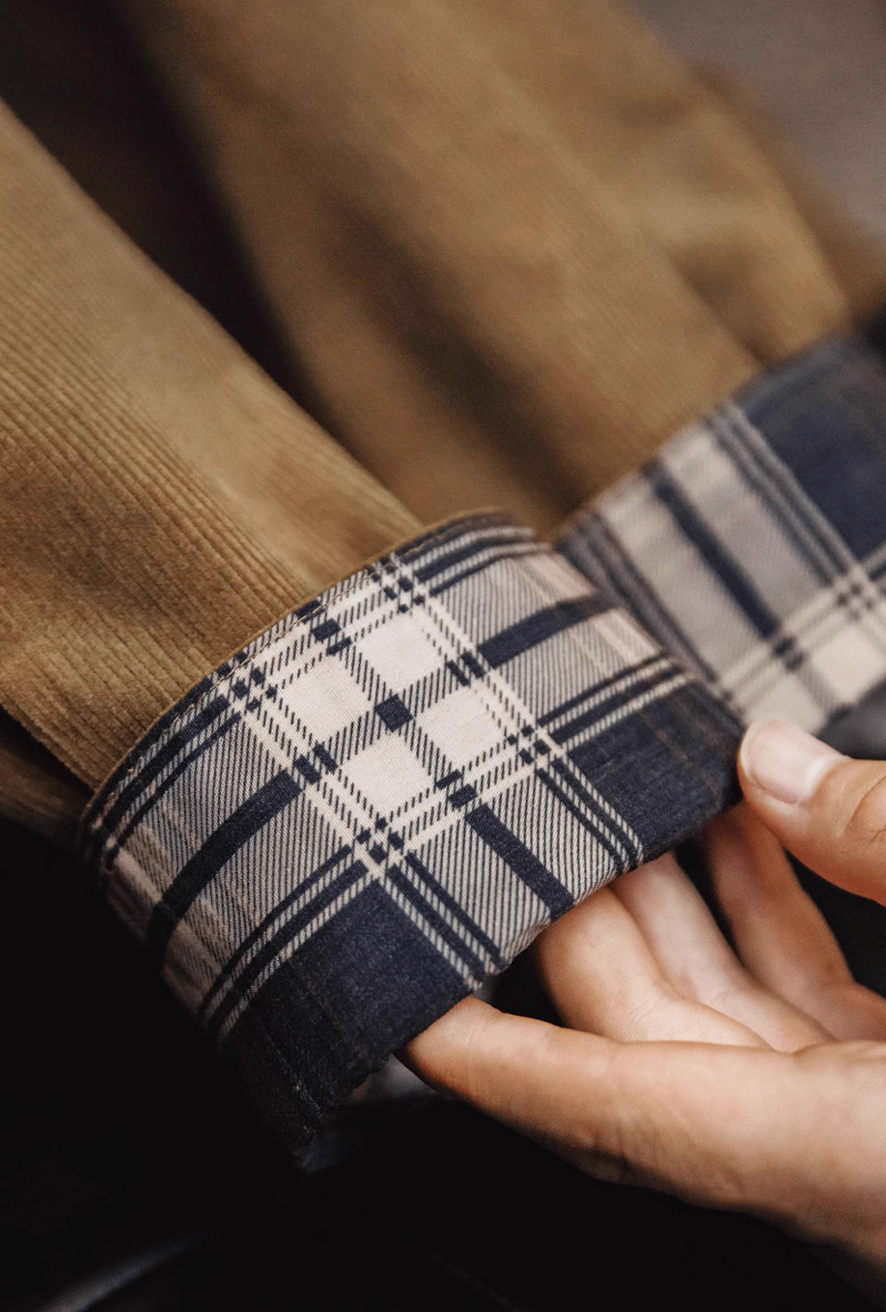Plaid lining detail inside sleeve cuff of corduroy Harrington jacket