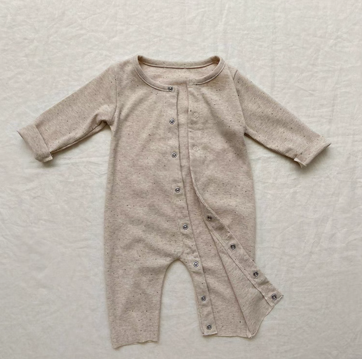 Oatmeal beige long sleeve baby romper with front snap opening for easy dressing