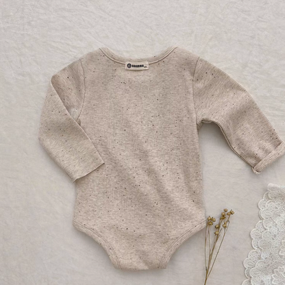 Back view of oatmeal beige baby bodysuit highlighting soft breathable fabric texture