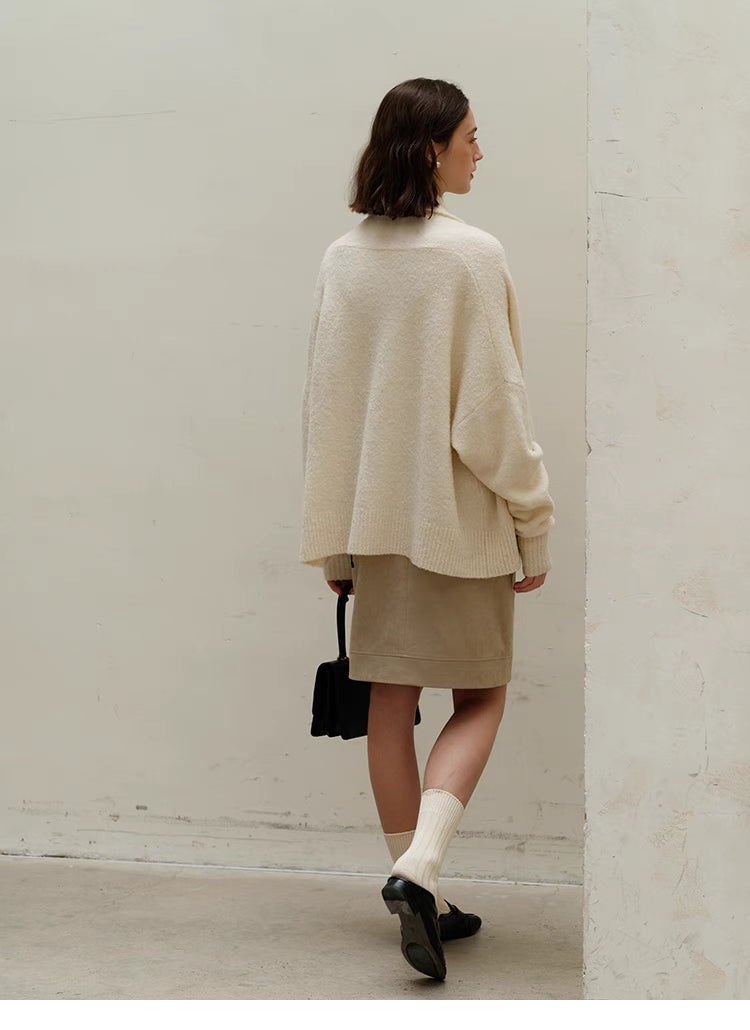 Back view of Cozy Elegance Oversized Knit Cardigan in Ivory highlighting loose silhouette, soft knit texture, and clean minimal design