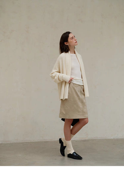Full-body walking look of Cozy Elegance Oversized Knit Cardigan in Ivory showcasing mid-length cut, oversized fit, and effortless everyday outfit