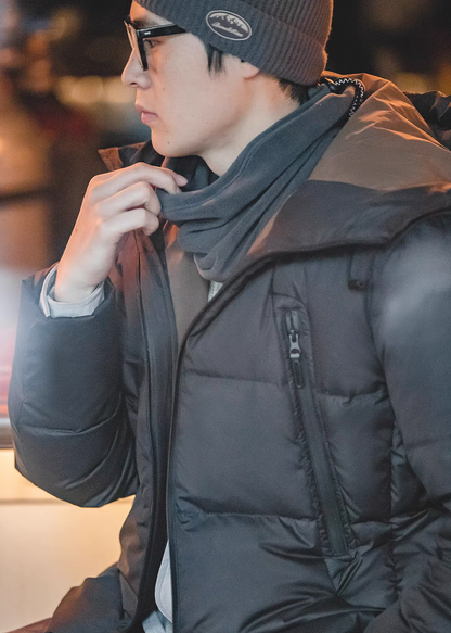 Side profile of Cozy Magic Neck-Warmer in gray worn with winter jacket highlighting minimalist design and comfortable fit