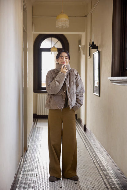 Full-body front view of Cozy Quilted Corduroy Coat in light brown gray featuring short length, oversized fit, and quilted warmth