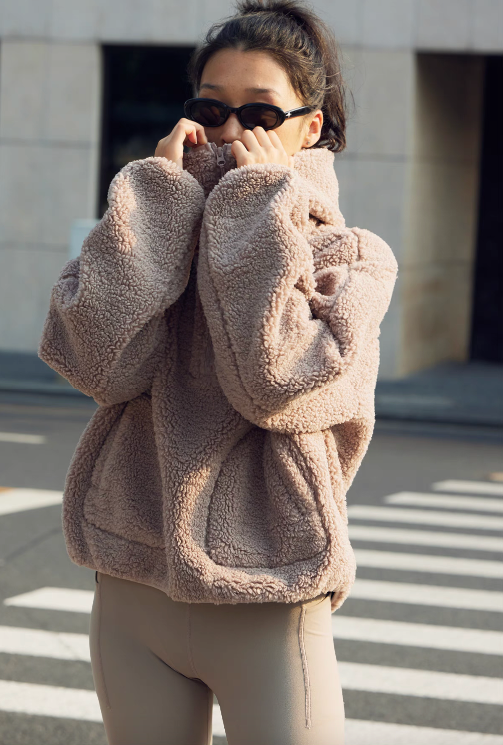 Front view of Cozy Sherpa Thermal Hoodie Pullover in brown with half-zip pulled up, kangaroo pockets, and cozy oversized streetwear style