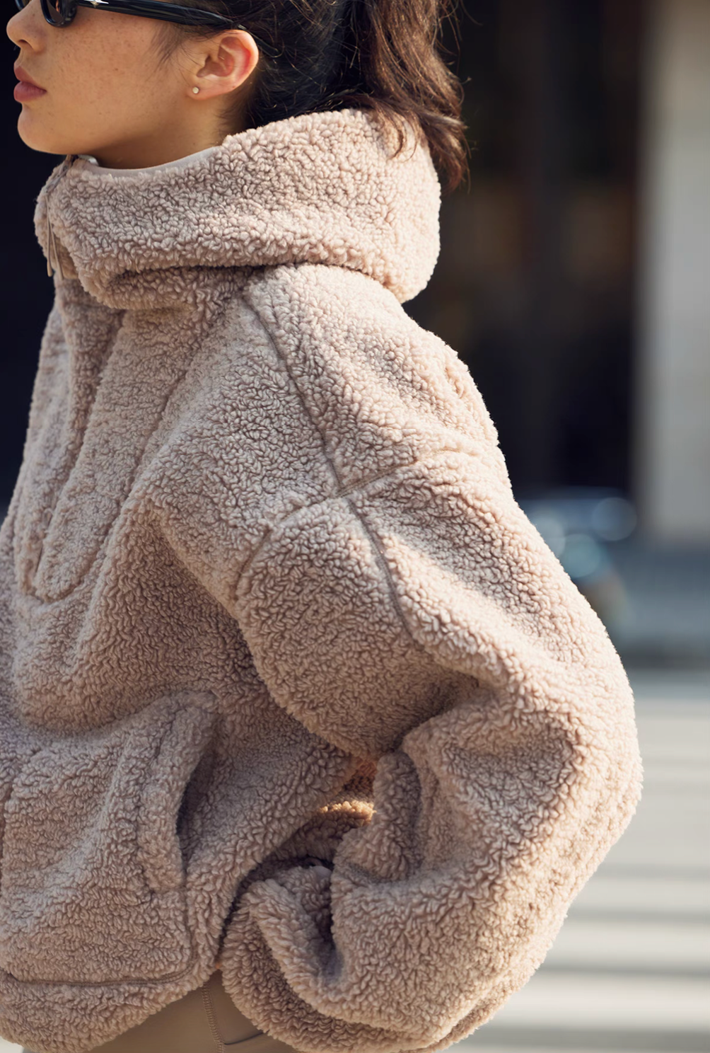 Side profile of Cozy Sherpa Thermal Hoodie Pullover in brown highlighting hood structure, textured fleece fabric, and oversized silhouette