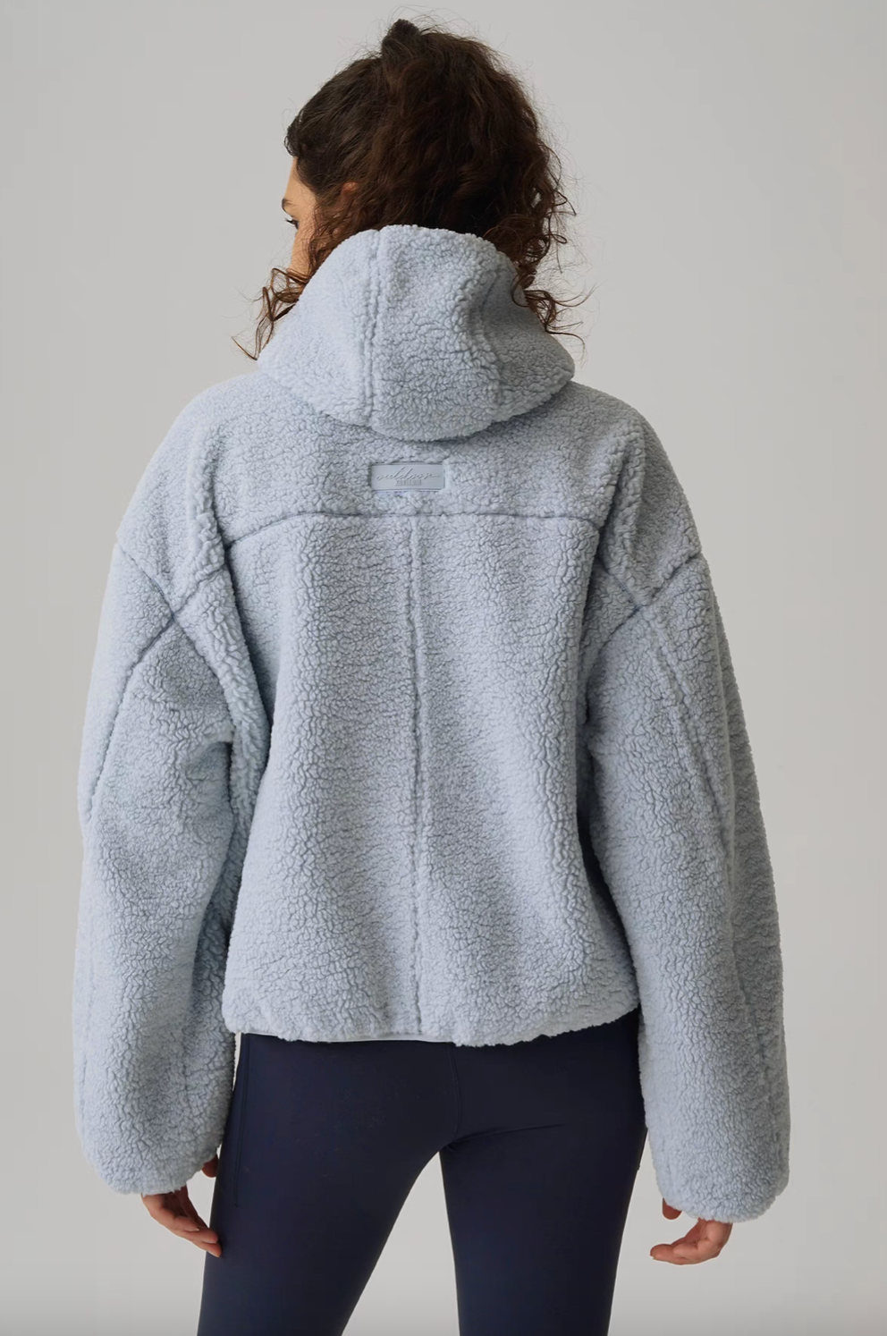 Back full view of Cozy Sherpa Thermal Hoodie Pullover in light blue showing hooded design, oversized fit, and clean seam structure