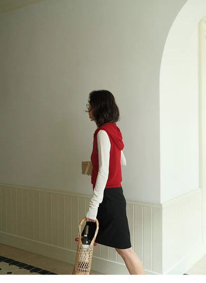 Side profile of red Cozy Sleeveless Pullover Sweater with hood, showcasing clean silhouette and sleeveless design