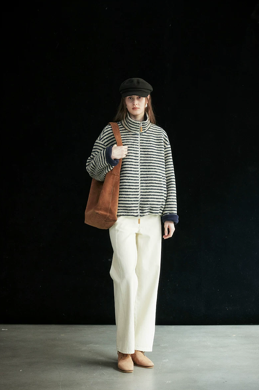 Front view of a Cream/Navy Stripe fleece-lined jacket zipped up, with rolled navy cuffs