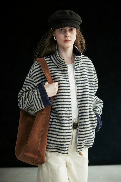 Cream/Navy Stripe oversized zip jacket worn open, showing the navy fleece lining at the collar