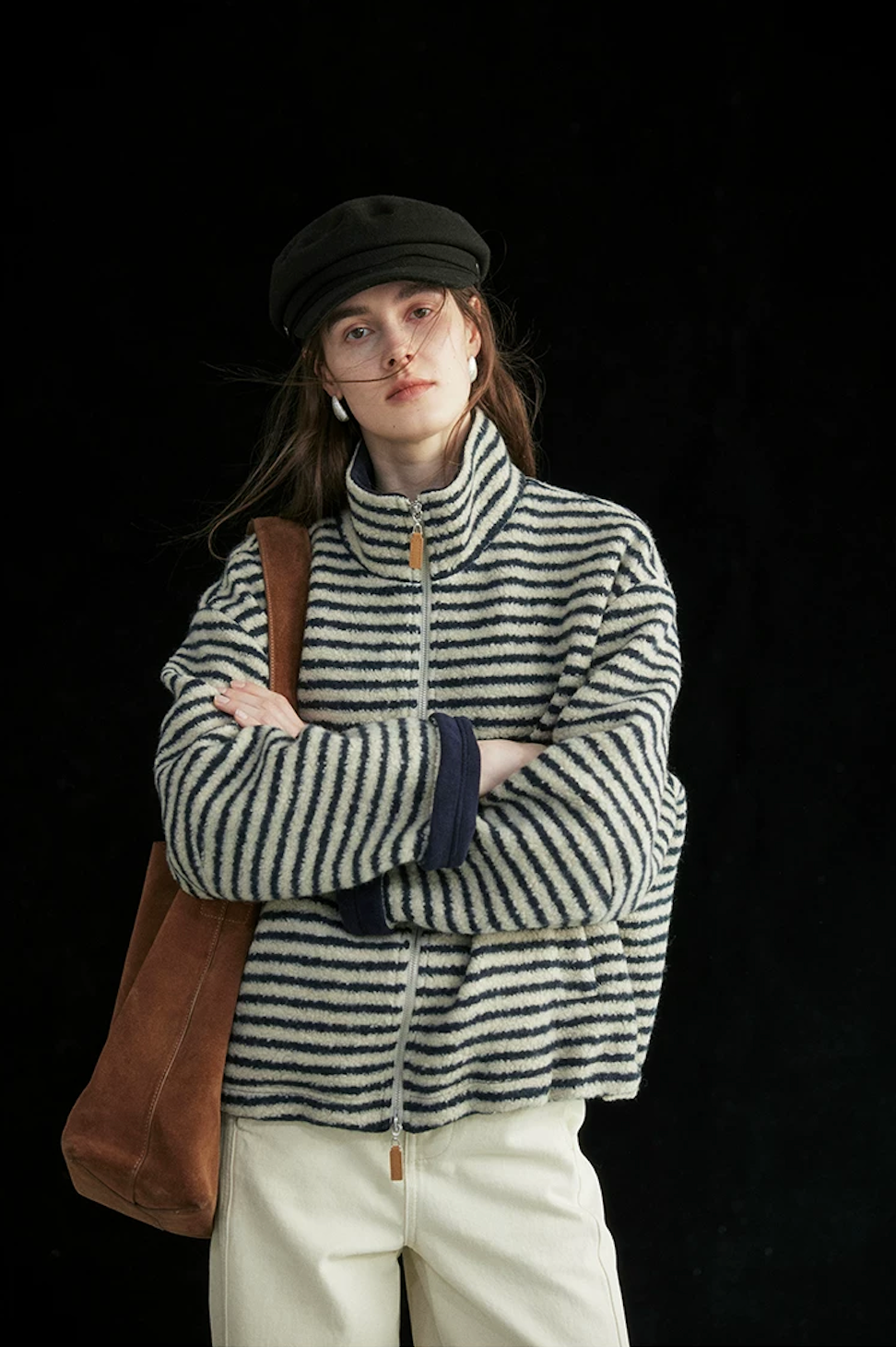 Cream/Navy Stripe wool-blend jacket zipped to the stand collar, with rolled navy fleece cuffs