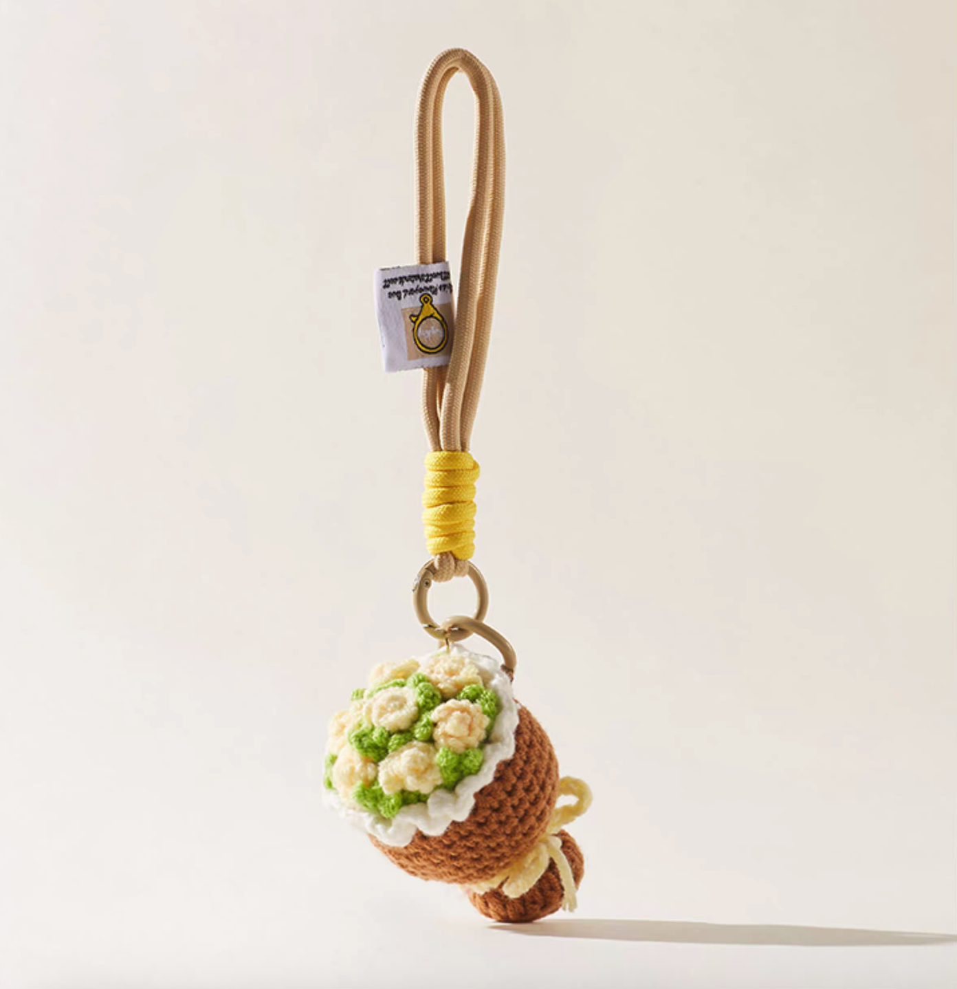 Camel brown crochet bouquet charm with yellow rope detail.