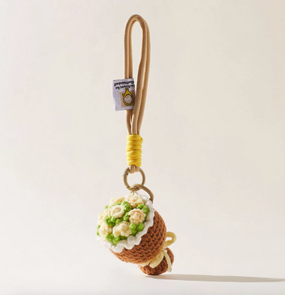 Camel brown crochet bouquet charm with yellow rope detail.