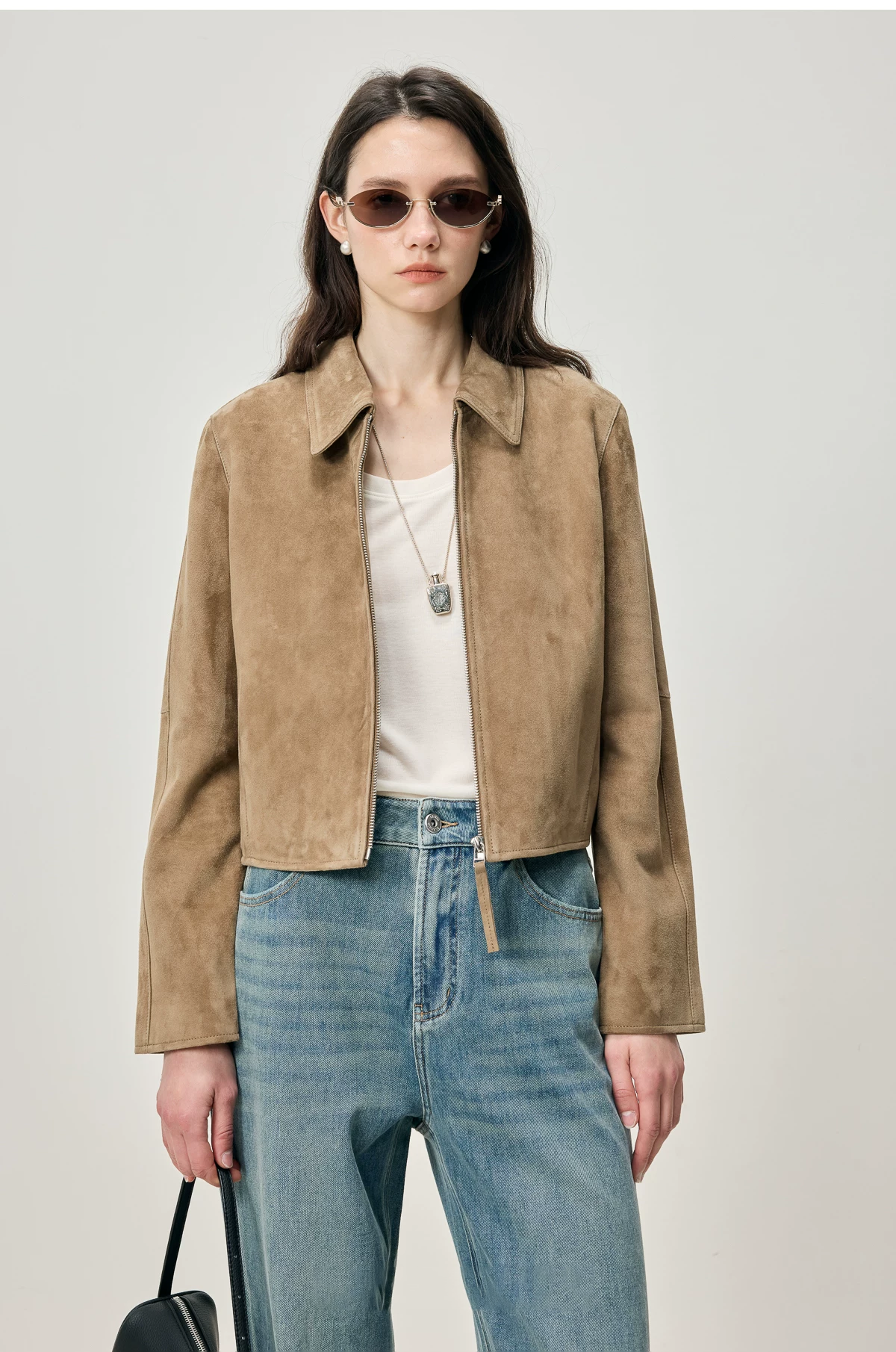 Fawn brown cropped sheepskin suede jacket with point collar and zip front, worn open