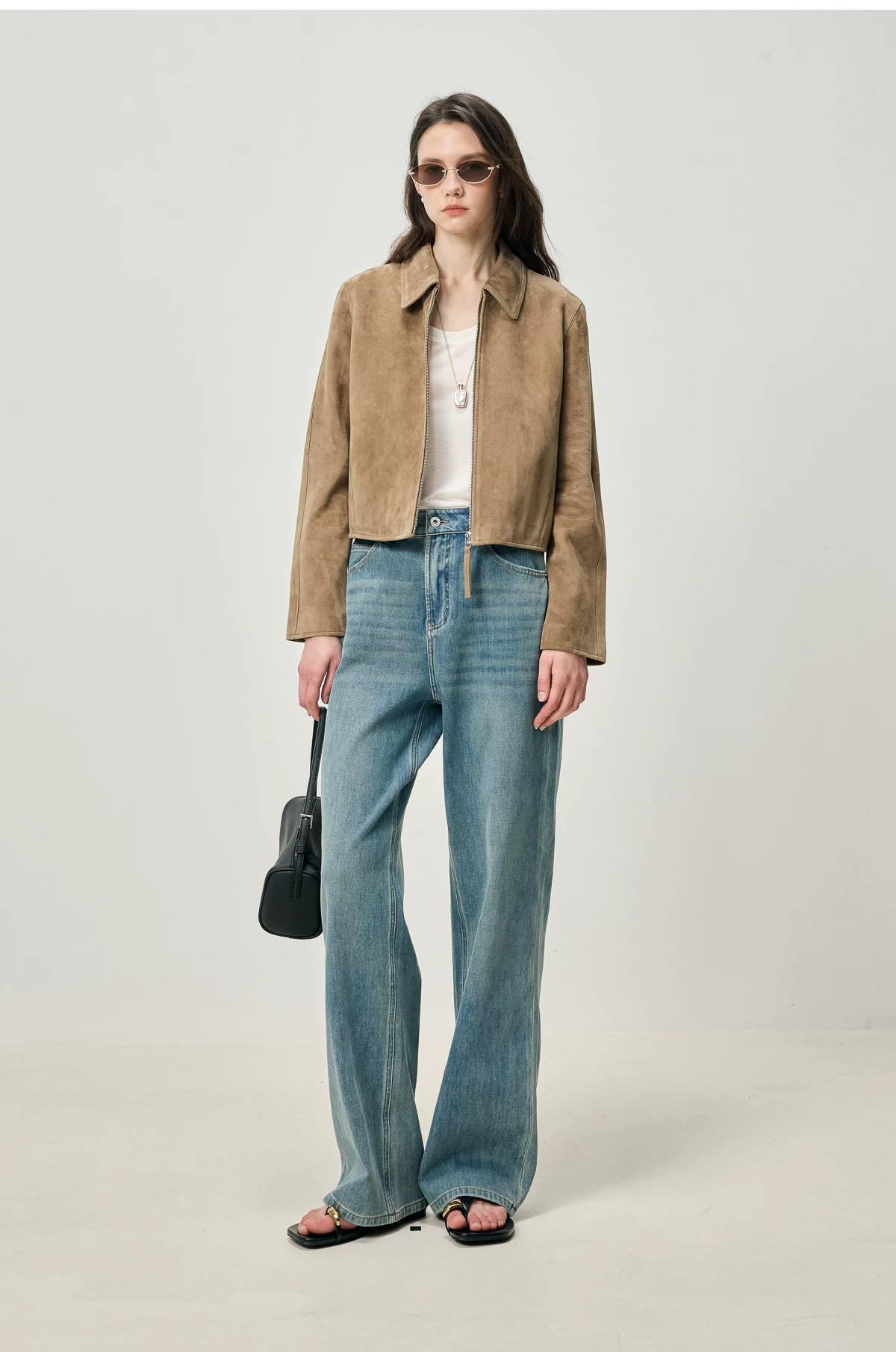 Full-length view of fawn suede zip jacket with white tank and wide-leg jeans
