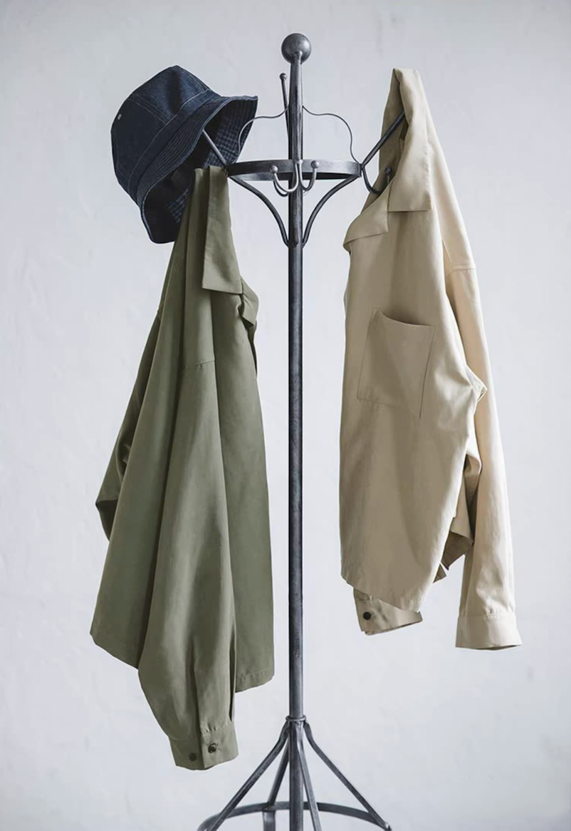 Light green and light khaki Cuban collar shirts hanging with denim hat.