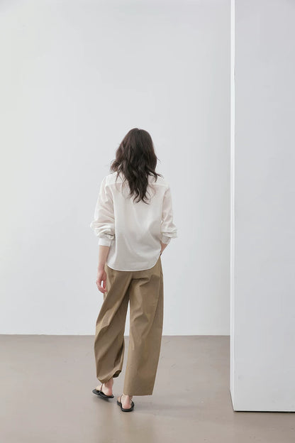 Back view of ivory Cuban collar shirt showing dropped-shoulder silhouette