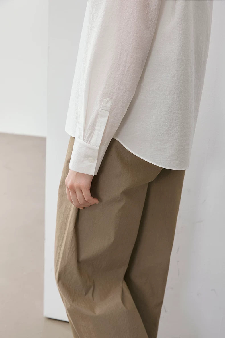 Close-up of ivory Cuban collar shirt cuff and sleeve detail