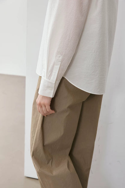 Close-up of ivory Cuban collar shirt cuff and sleeve detail