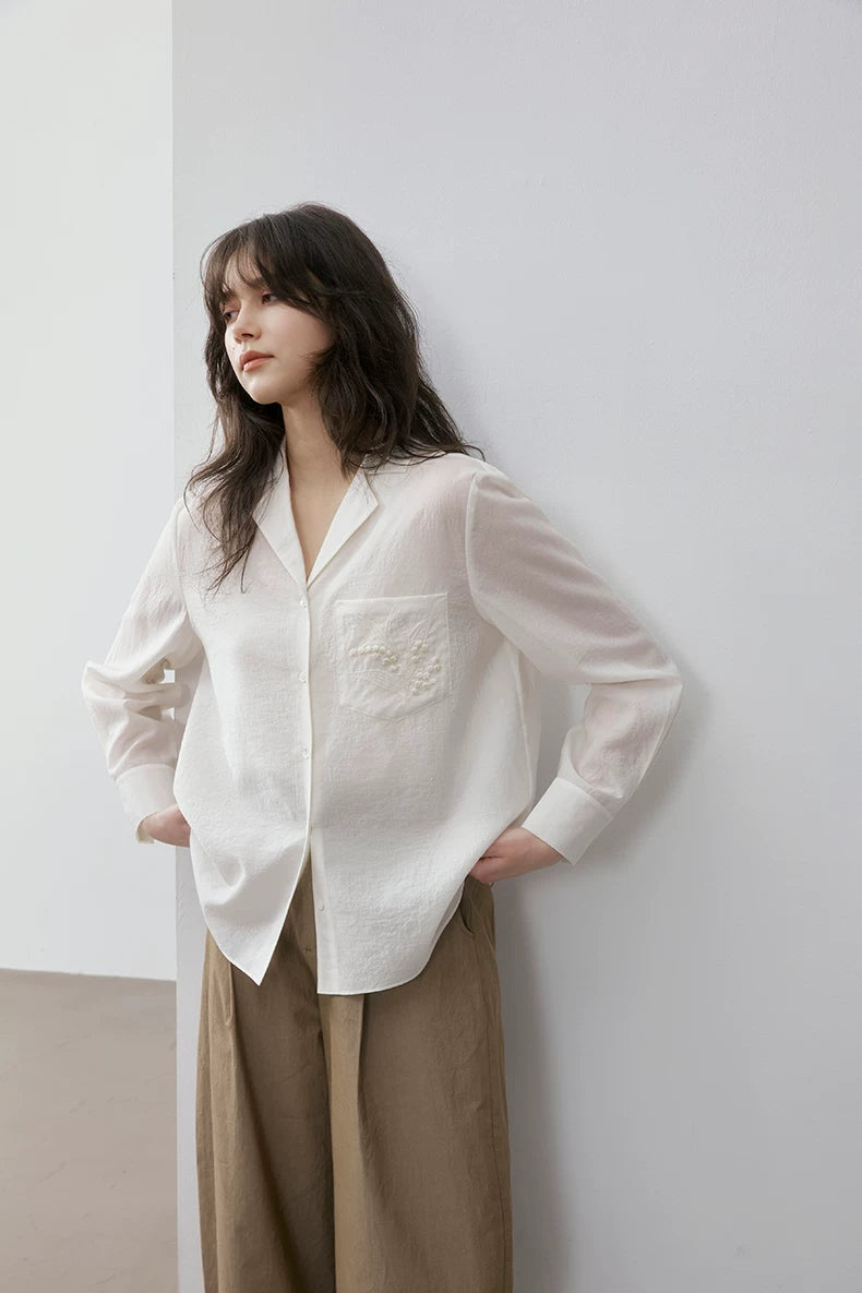 Front view of ivory Cuban collar shirt with khaki trousers