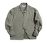 Men’s Cuban collar shirt in light green, peached texture flat lay.
