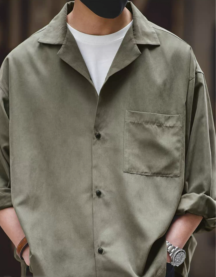 Light green Cuban collar shirt styled casually with white tee.